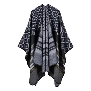 Knit open front poncho wrap with geometric pattern and stripes in black and grey