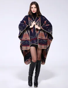Close-up of geometric tribal pattern and yellow hand-stitched edges on thick knit shawl