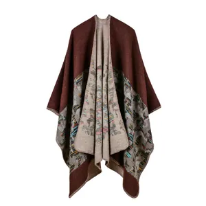 Detail of ethnic geometric print on thick knit shawl with contrast edge stitching