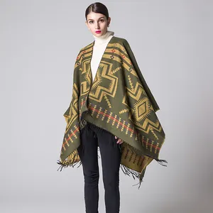 Close-up of olive green cashmere-like shawl featuring ethnic geometric patterns and fringe