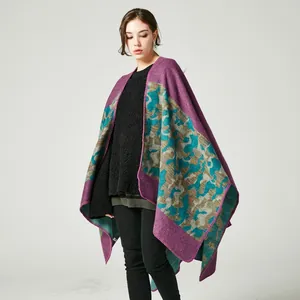 Detail showing the burgundy camouflage texture and soft knit fabric of this warm poncho