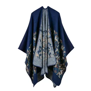 Detail view of the deep blue knit shawl featuring colorful ethnic patterns and clean edges