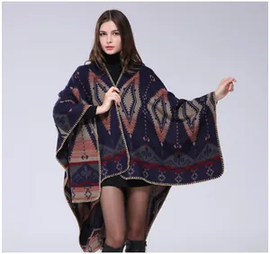 Detail of Aztec pattern knit poncho with hand-stitched edges and geometric design