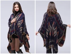 Detail of hand-stitched edges and geometric Aztec pattern on thick warm knit shawl