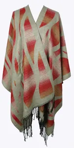 Detail of soft cashmere shawl with geometric patterns and black fringed edges