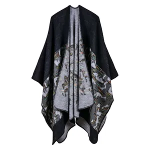 Detailed view of knitted shawl fabric with colorful abstract jacquard pattern