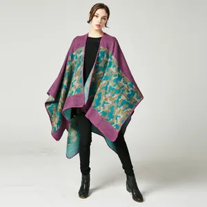 Detail of purple camouflage knit poncho showing thick material and fine stitching