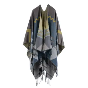Bohemian geometric knit poncho shawl with fringes and warm patchwork pattern