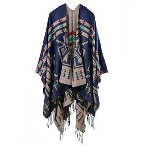 Detail of bohemian ethnic shawl with colorful floral patterns and fringe tassels
