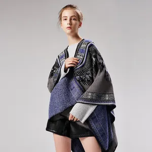 Detailed view of the ethnic geometric pattern on the blue and grey knitted shawl