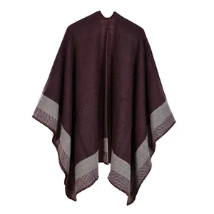 Detail of deep purple knitted shawl with grey patchwork and diagonal stripe pattern textures