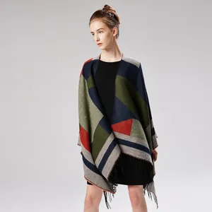 Detailed view of jacquard geometric pattern shawl with tassels and color-block design