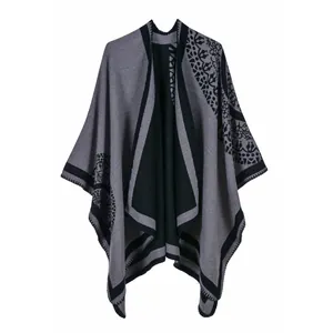 Classic British style dark grey knitted poncho with black mandala floral patterns