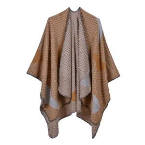 Detail of knitted shawl with ginger yellow star patterns and grey border trim