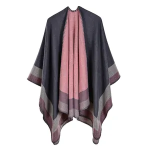 Detail view of double-sided knit shawl with gray and pink contrast and edge stripes