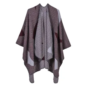 Close-up of knit fabric texture on burgundy and grey star patterned shawl wrap
