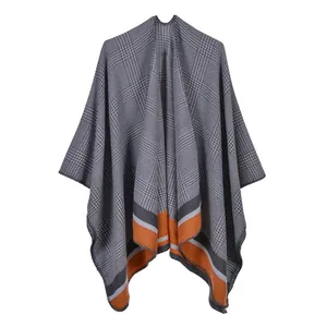 Detailed view of the Glen Check pattern and contrast stripes on this knit shawl