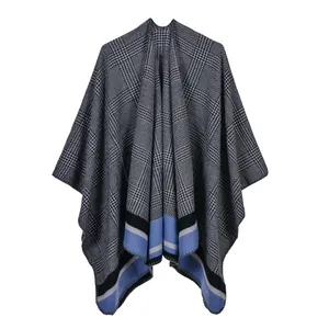 Close-up of houndstooth knit shawl with contrasting blue and grey striped borders