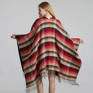 Detailed view of the red and black plaid pattern shawl with fine tassel edge decor