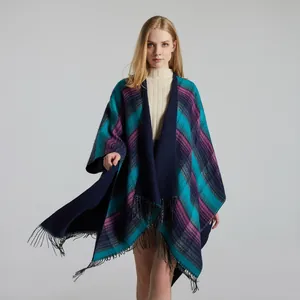 Detailed close-up of blue and purple plaid cashmere shawl with black tassel fringes