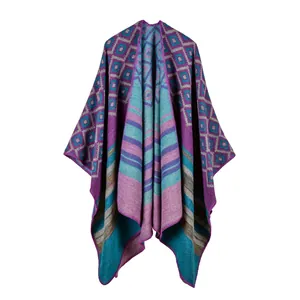 Bohemian style knitted shawl featuring purple and cyan stripes with geometric patterns