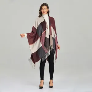 Detail of checkered shawl with burgundy and grey blocks and delicate fringe hem