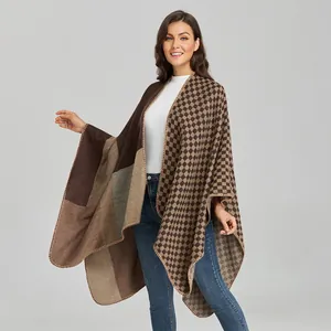 Women's warm patchwork plaid poncho cape in earth tones with a classic knit texture