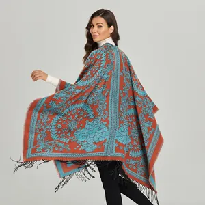 Women's vintage paisley shawl with orange and blue contrast colors and black fringe trim