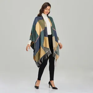 Detail shot of multi-color plaid shawl with fringe tassels in navy and ginger yellow