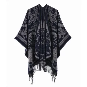 Close-up of navy blue and grey paisley ethnic knit shawl with fine tassel detailing