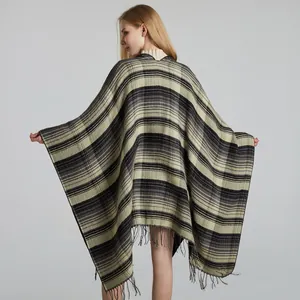 Detail view of thickened Scottish plaid shawl with fringe tassels and soft texture