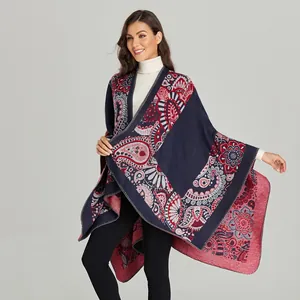 Close-up of paisley pattern on thick navy and red cashmere-feel knit shawl cape