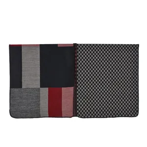 Close-up of geometric color block and plaid pattern cashmere poncho shawl wrap