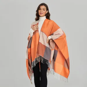 Close-up of vintage jacquard check shawl with orange grey color block and fringe
