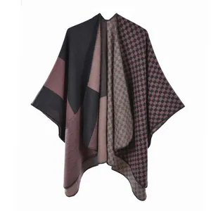 Close-up of color-block knit shawl with refined edge stitching and soft texture