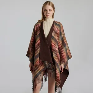 Classic Scottish plaid shawl cape with tassels in warm brown and mustard tones