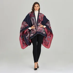 Detailed paisley pattern on warm ethnic knit poncho cape for women in blue and red