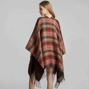 Classic plaid shawl cape for women with tassel details and warm knit fabric