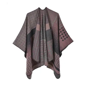 Close-up of geometric pattern jacquard and fine stitching on a thick warm poncho