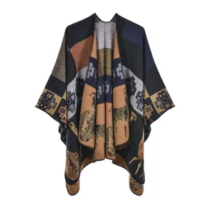 Ethnic knit poncho cloak with geometric patterns and reindeer motifs in dark navy and brown