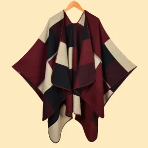 Women's burgundy and black plaid knit shawl poncho with elegant split hem design