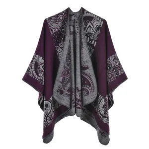 Detail of purple paisley knit shawl with reversible jacquard pattern and soft texture