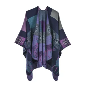 Detailed view of the ethnic geometric pattern and animal totem on the knitted poncho