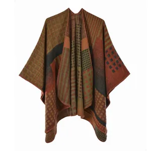 Close-up of bohemian knit poncho featuring colorful geometric patterns and stitching details