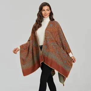 Detail of bohemian paisley shawl with vibrant patterns and high-quality stitched edges