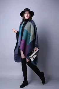 Women's warm knit poncho in deep blue and teal geometric color-block pattern