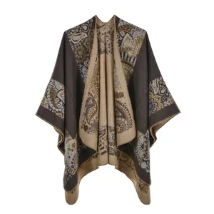 Detail of ethnic paisley pattern on a thick faux cashmere winter poncho shawl