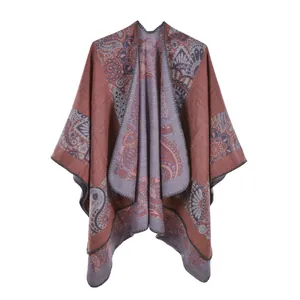 Close-up of vintage paisley pattern on a thick faux cashmere shawl with knitted edges