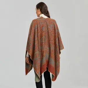 Vintage paisley thick knit shawl cape for women in rust orange with bohemian fringe detail