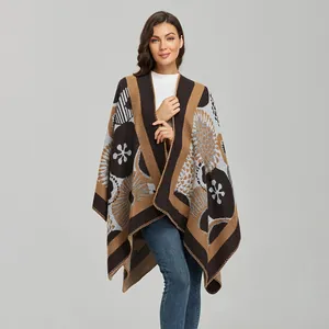 Women's knit poncho cape with vintage floral patterns in brown, black, and blue tones